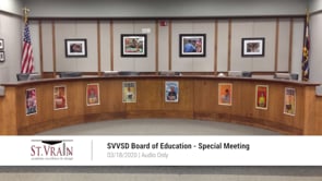 A board room with pictures on the wall