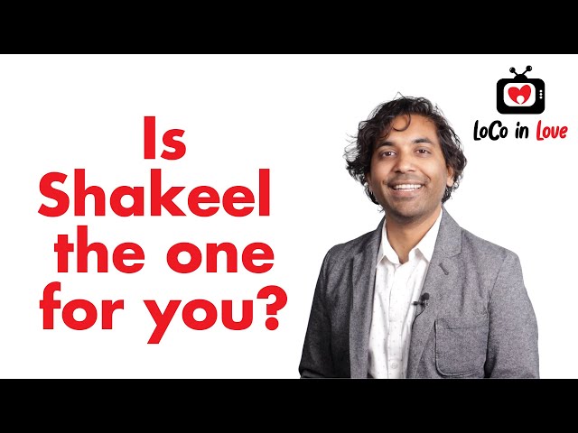 A man standing in front of a sign that says is shakel the one for you