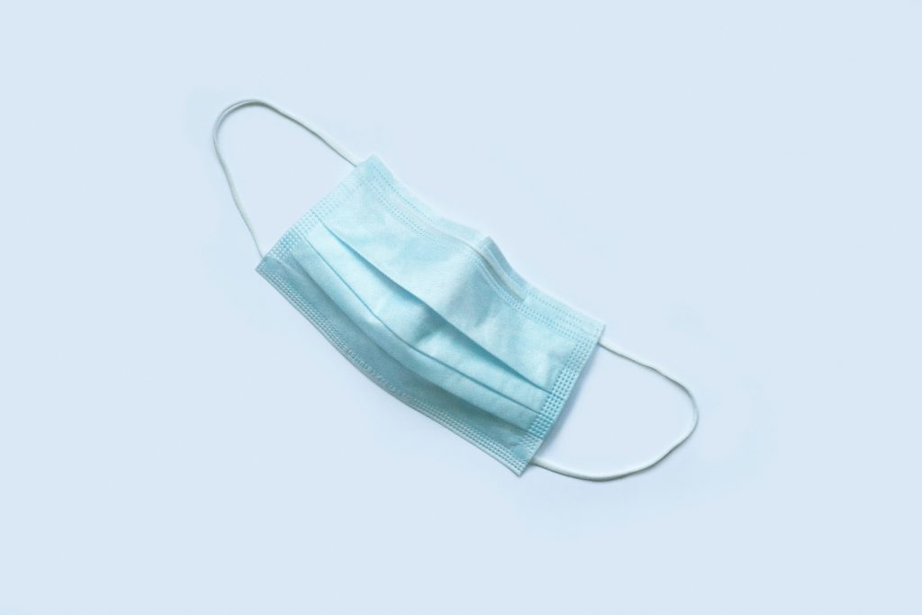 a surgical mask on a white background