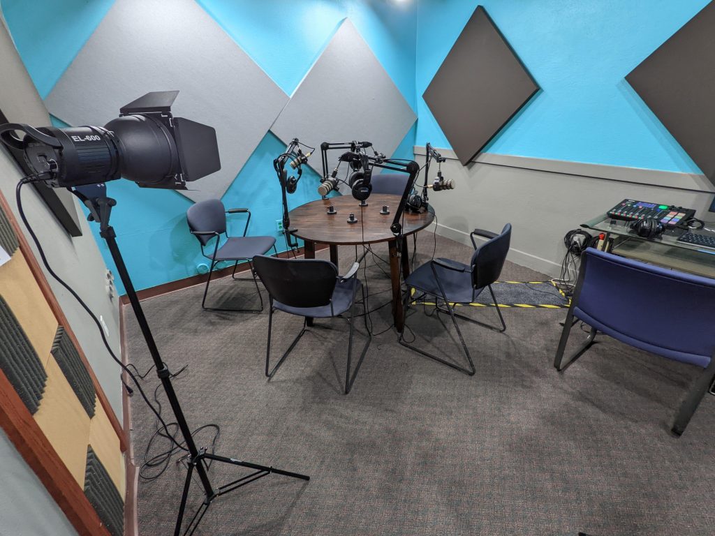 A camera set up in a room with chairs for surveillance purposes