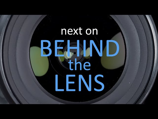 a camera lens with the words behind the lens