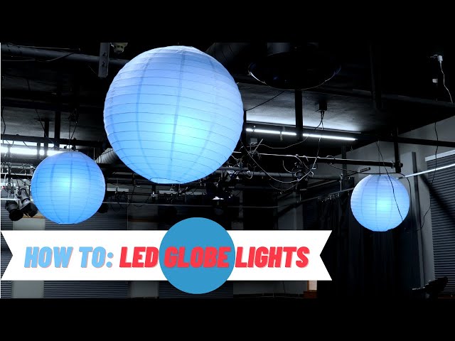 blue lanterns hanging from the ceiling to illuminate the room