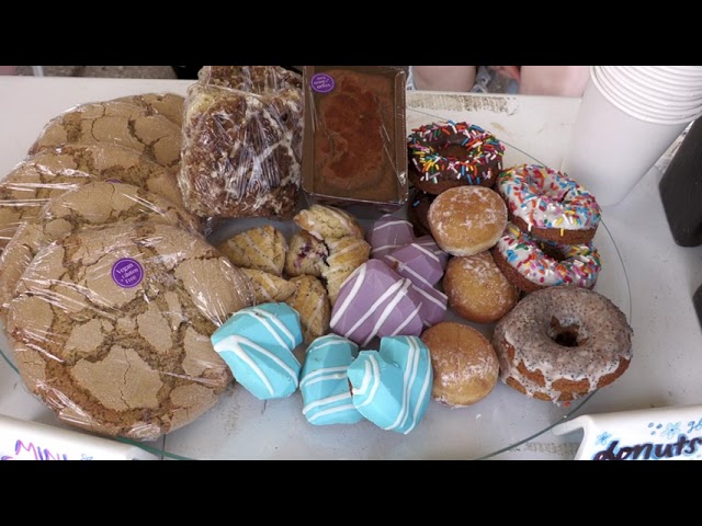 A variety of delicious doughnuts displayed on a table