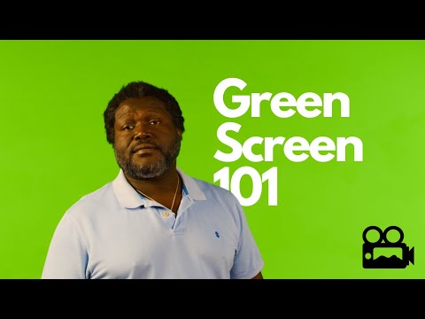 A man standing in front of a green screen for video editing purposes